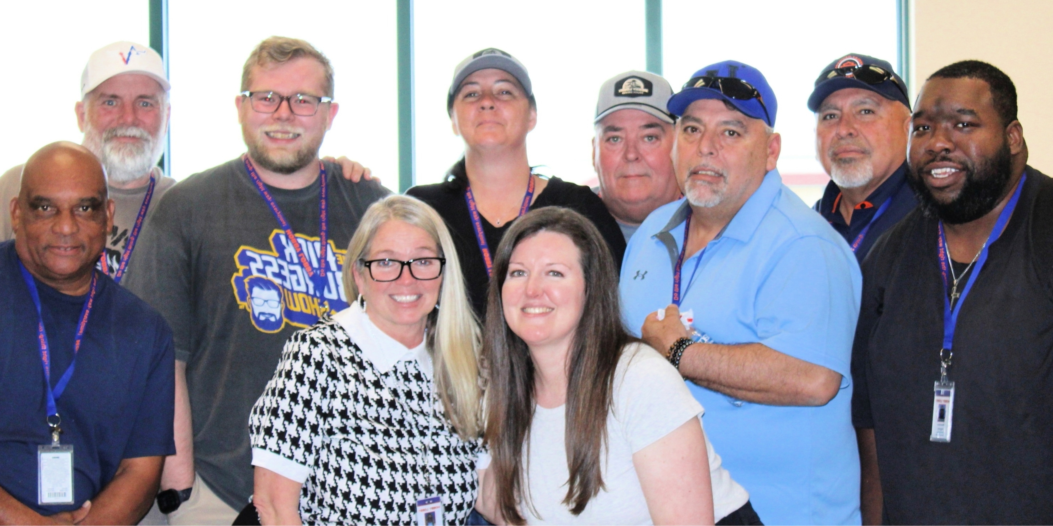 A group of Hobby Lobby truck drivers smiling